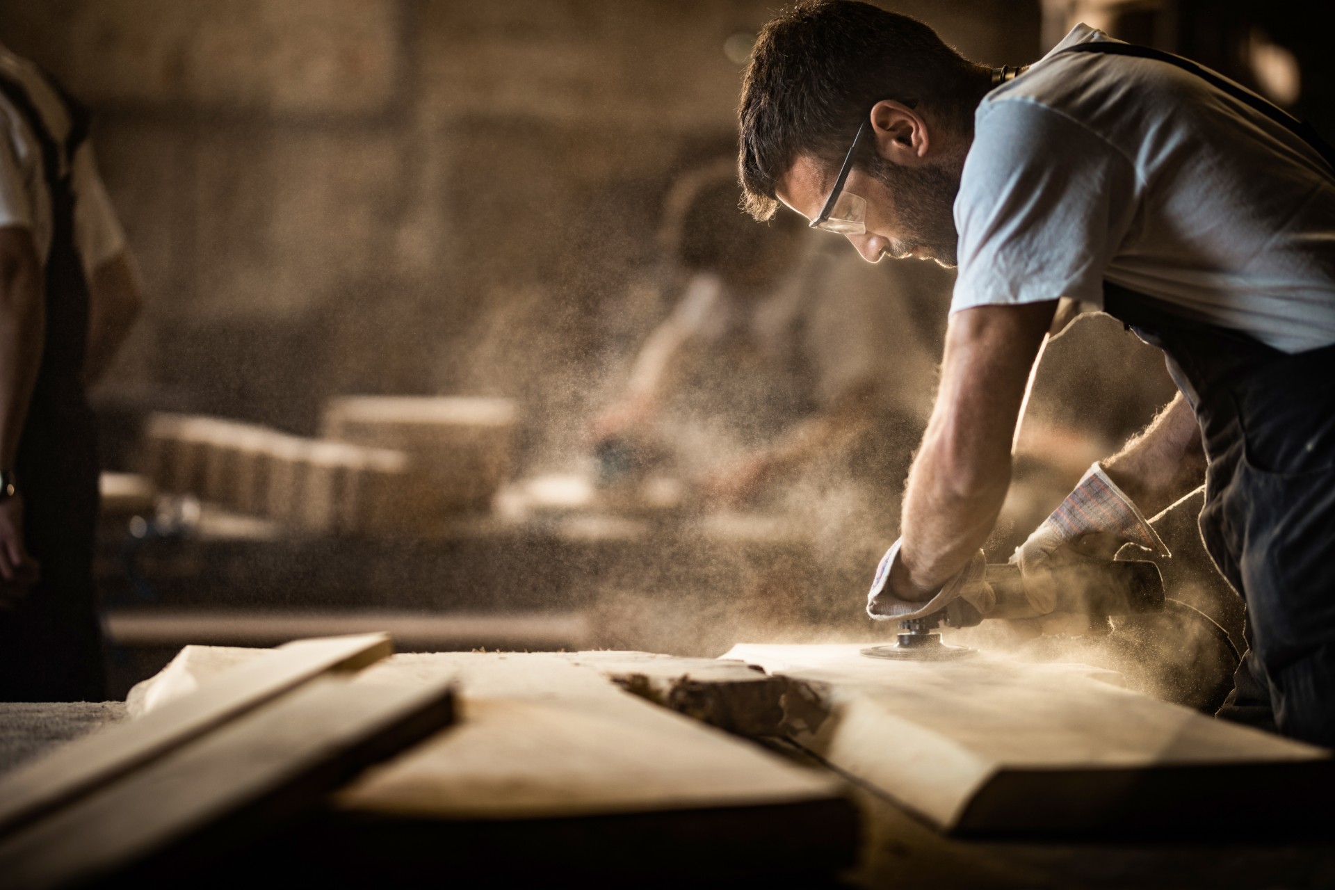 Image of carpenter sanding wood